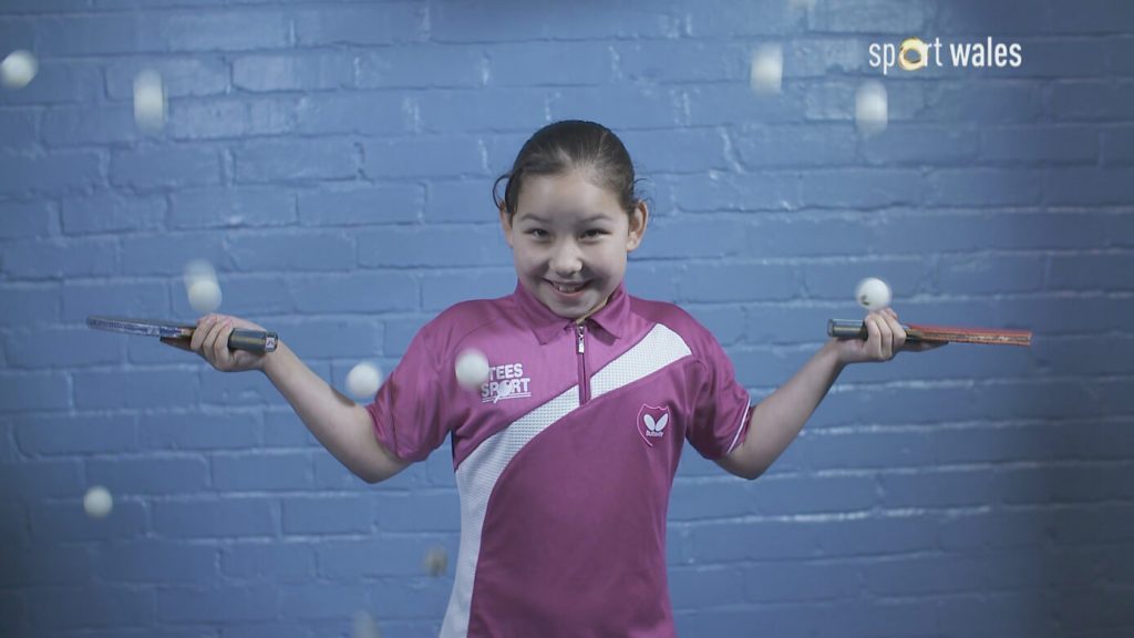 Anna Hursey with falling table tennis balls